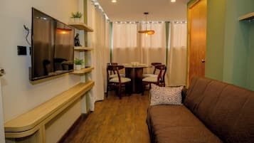 Comfort Apartment, 1 Queen Bed | Living area | Flat-screen TV