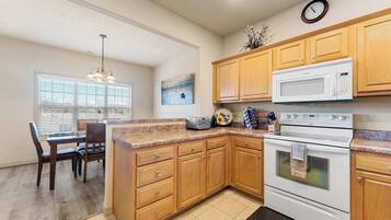 Condo, Multiple Beds, Balcony, Mountain View (The Nest on Birdie Lane) | Private kitchen | Fridge, microwave, oven, stovetop