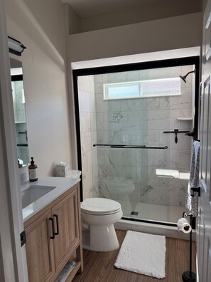 Shower, hair dryer, towels, soap