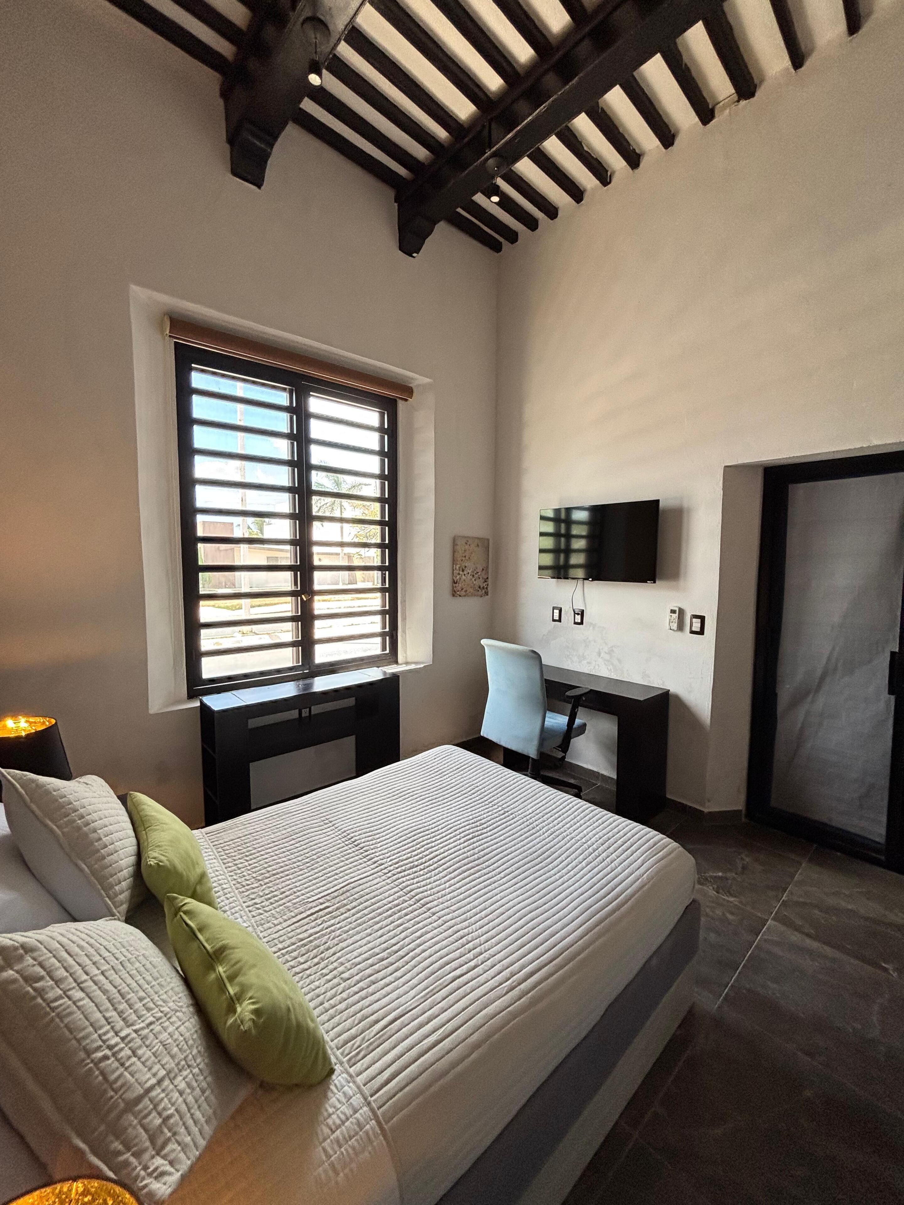 Comfort Room | Desk, blackout drapes, iron/ironing board, free WiFi