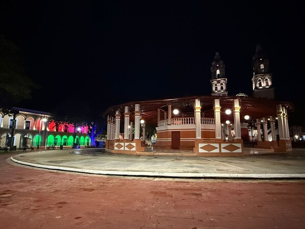 A historic building with a central pavilion and two towers.