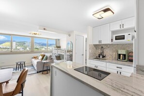 Fridge, microwave, stovetop, coffee/tea maker