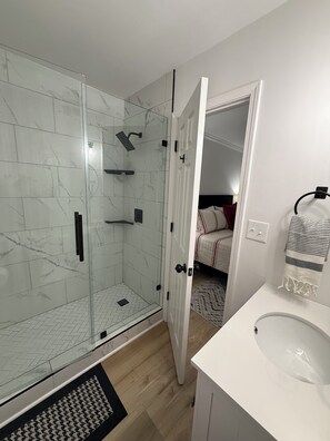 Shower, towels, soap, toilet paper