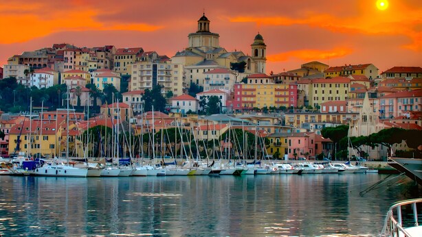 A coastal town with a prominent church, colorful buildings, and a marina with boats. - Holiday Home 'Franca Nature Holidays' with Private Terrace, Private Garden and Wi-Fi (Rezzo)