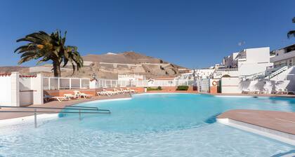 Vacation Home 'Atardecer En Caideros' with Sea View, Shared Pool and Wi-Fi