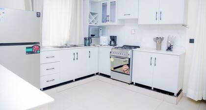 4-bedroom estate in welcoming Kigali-Rwanda with WiFi in a family-friendly area.