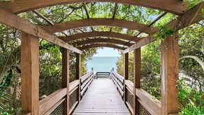 A wooden boardwalk leading to a gazebo with a view of the ocean. - One Seagrove Place 1404 (Santa Rosa Beach)