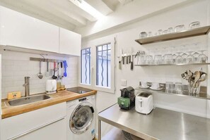 Fridge, microwave, stovetop, coffee/tea maker