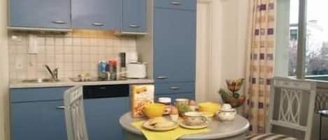 Fridge, stovetop, dishwasher, coffee/tea maker