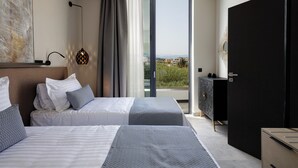 A modern hotel room with two beds, a large window, and a view of the city. - VillAgioi II - 2 BR Villa, Pool & BBQ, Walk to Beach (Chania)