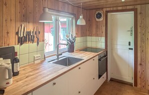 Fridge, stovetop, dishwasher, coffee/tea maker