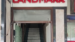 A staircase leading to a hotel entrance with a sign reading "HOTEL LANDMARK". - Hotel Landmark - Centre of City Chandigarh (Chandigarh)
