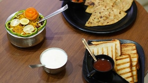 A meal with rice, a bowl of soup, grilled bread, and a small plate of flatbread. - Hotel Landmark - Centre of City Chandigarh (Chandigarh)