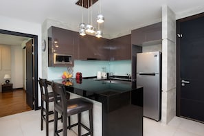 Family Apartment, 2 Bedrooms, Balcony, Garden View | Private kitchen | Electric kettle