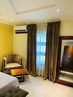 Deluxe Room, Balcony, City View | Desk, laptop workspace, blackout drapes, free WiFi