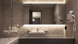 A modern bathroom with a rectangular sink, a handheld showerhead, and a hairdryer mounted on the wall. - 21heritage hotel (Wonju)