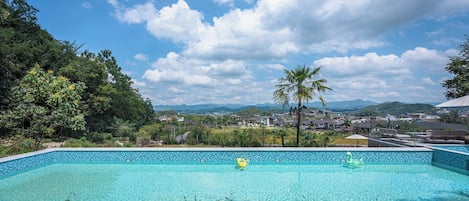 Seasonal outdoor pool, open 7:00 AM to 10:00 PM, pool umbrellas