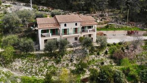 A two-story building with a tiled roof, surrounded by dense greenery and trees. - La Maison Blanche - BLAUSASC (BLAUSASC)