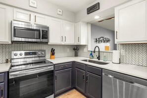 Fridge, microwave, oven, stovetop - Riverfront Condo | Walk Downtown | Pool + Parking (Nashville)