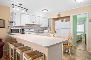 Fridge, microwave, oven, stovetop - Oceanside Three Bedroom Condo Steps From the Beach (Ocean City)