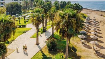 On the beach, sun loungers, beach umbrellas, beach towels