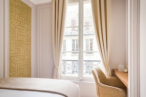 Hypo-allergenic bedding, pillow-top beds, in-room safe