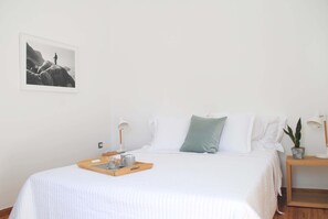 A neatly made bed with a tray of breakfast items, a bedside lamp, and a framed picture on the wall. - Athens Residence Best Area of Acropolis (Athens)