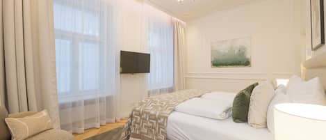 Apartamento executivo | Cortinas blackout, ferros/tábuas de passar roupa, Wi-Fi de cortesia