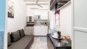 Departamento Confort, vista a la ciudad | Área de sala de estar