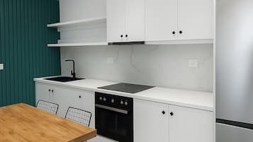 Two Bedroom Apartment | Private kitchen | Fridge, microwave, oven, stovetop