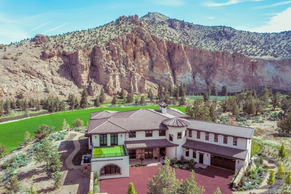 Aerial view of the estate nestled among rugged canyon walls—offering unmatched privacy and connection to the high desert landscape