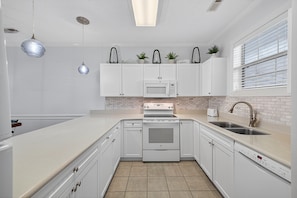 Condo, 2 Bedrooms | Private kitchen | Fridge, oven, coffee/tea maker, toaster