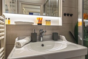 Shower, hair dryer, towels, soap