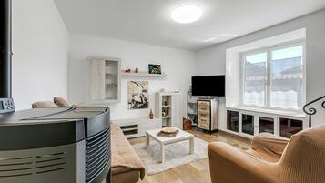 Family House, 2 Bedrooms (L' angolino di Cannobio) | Living area | 32-inch Smart TV with cable channels, fireplace