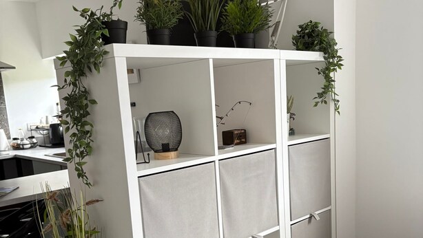 A white storage unit with multiple compartments, some containing plants and a small lamp. - Peaceful escape in historic Meath near Slane, Tara, Newgrange, and Dublin (Slane)