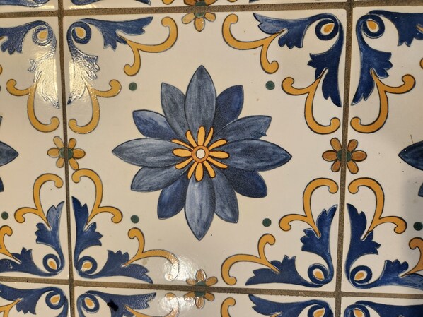 A tiled wall with a floral pattern. - New Luxurious Mountain Escape with Spa & Views (Sugar Mountain)