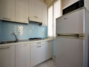 Fridge, microwave, stovetop, cookware/dishes/utensils