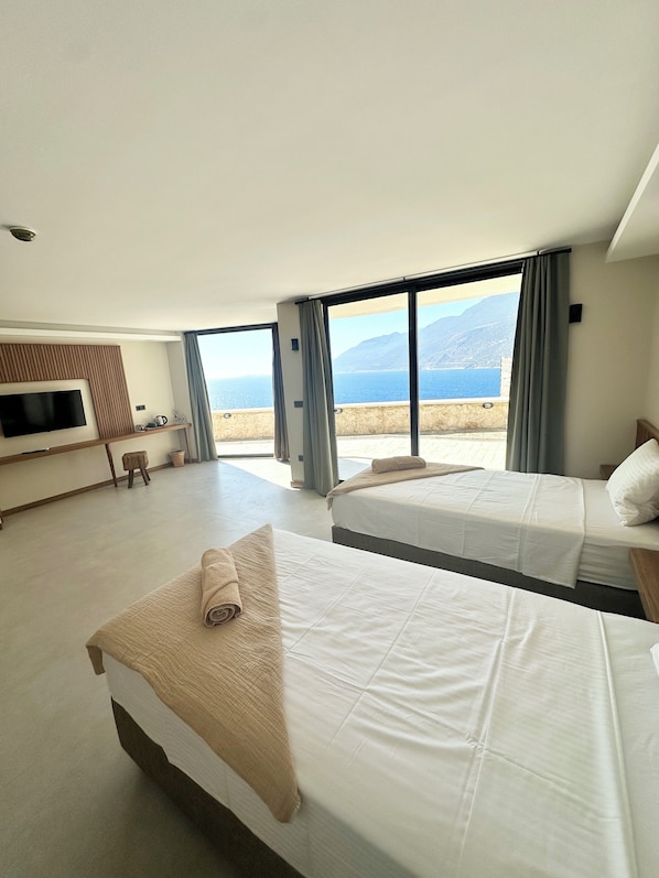 Quarto casal ou duplo superluxo, 1 cama King, vista para o mar | Wi-Fi de cortesia, roupa de cama