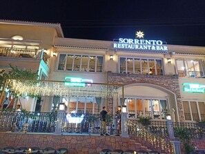 A restaurant with a sign reading "Sorrento Restaurant & Bar" and a Heineken logo.