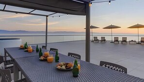 Outdoor dining - Waterfront condo w/ pool, hot tub & beach access (Nuevo Vallarta)