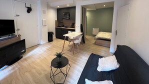 A modern apartment with a living room, dining area, kitchenette, and a bedroom. - Superb studio with sleeping area! Old Nice! (Nice)