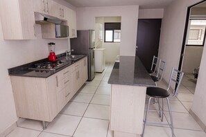 Fridge, microwave, cookware/dishes/utensils