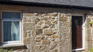 A stone house with a window and a door. - Chyancrowse (Penzance)