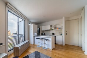 Fridge, microwave, coffee/tea maker, cookware/dishes/utensils