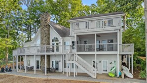 A multi-story building with balconies and a covered porch area. - Blissfully Together- Blue Heron + Back Porch Sleeps 22 (Mooresville)