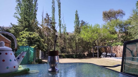 Outdoor spa tub. Nancy and Carlos's house, view of the mountains, swimming pool and barbecue area.