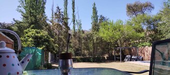 Nancy and Carlos's house, view of the mountains, swimming pool and barbecue area.