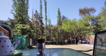Nancy and Carlos's house, view of the mountains, swimming pool and barbecue area.