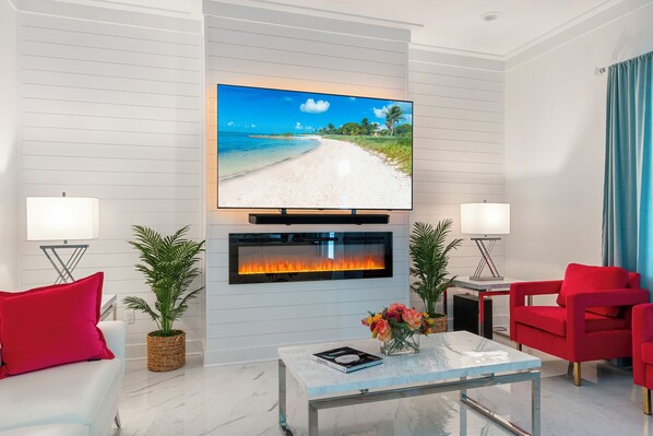 Smart-tv, eldstad, tv-spel och en stereo