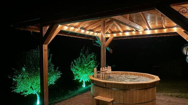 A wooden hot tub under a gazebo with steps leading up to it, surrounded by a deck. - Villa White Stone - Zlatograd (Zlatograd)